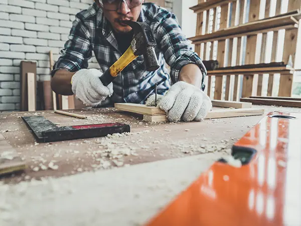 A contractor working with wood