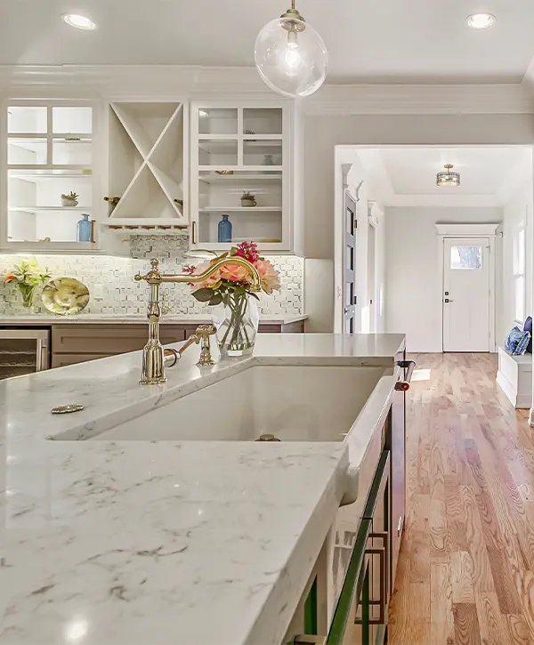 A kitchen countertop made of quartz in a space with LVP flooring