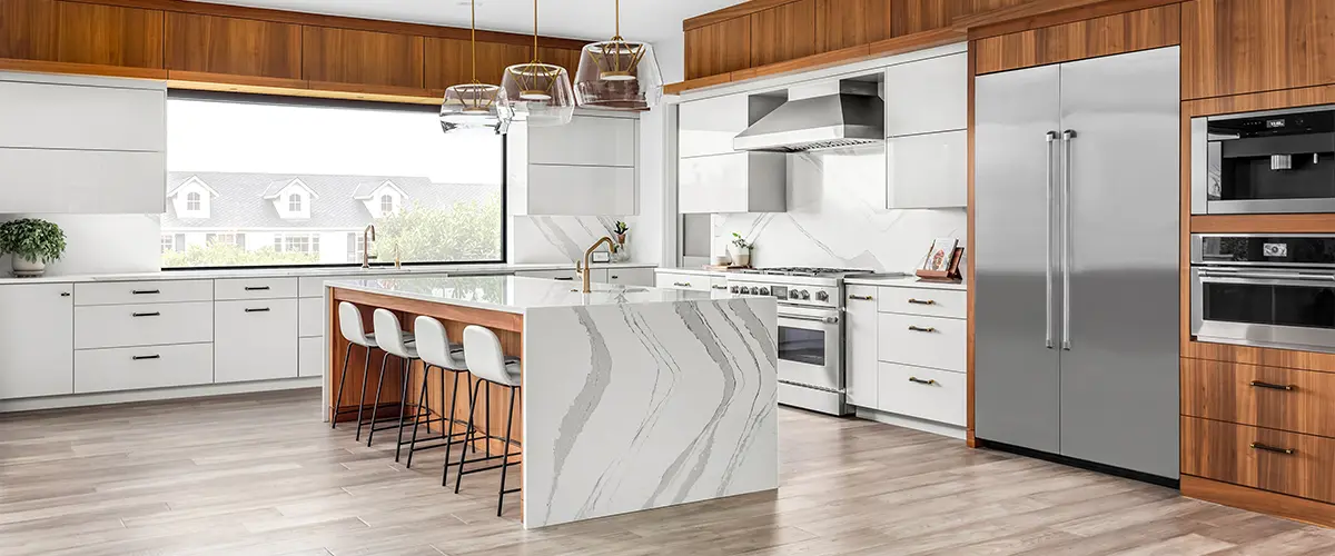 An upscale kitchen remodeling in Tulsa, OK, with quartz waterfall island