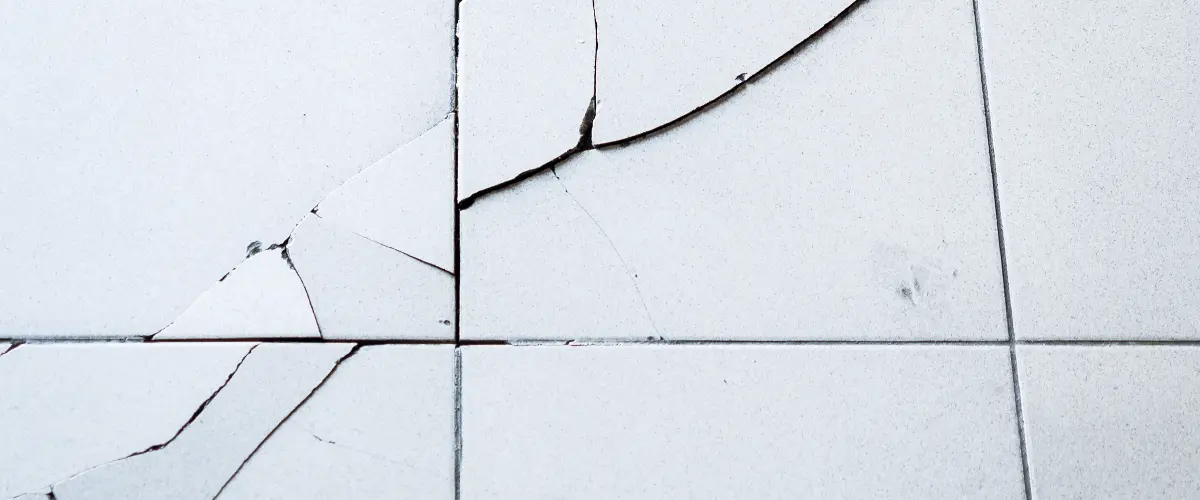 Cracked Floor Visible Through Tile
